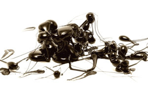 Abstract fluid forms in motion showing chaotic patterns and unpredictable movement illustrating chaos theory principles